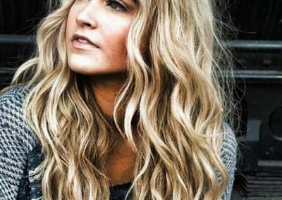 lady with long curly blonde hair